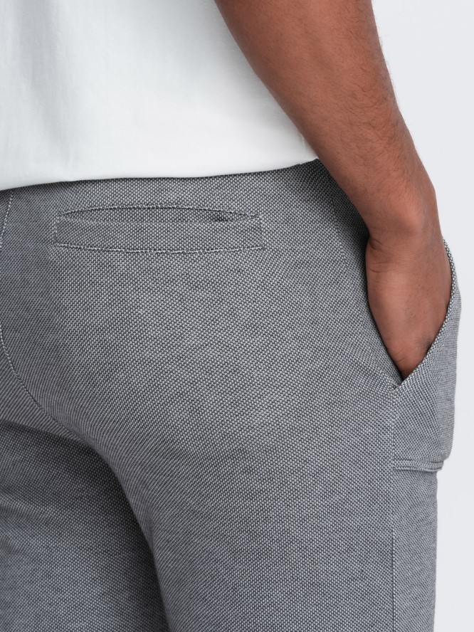 Spodnie męskie dresowe ze strukturalnej dzianiny - grafitowe V5 OM-PASK-0211 - XXL