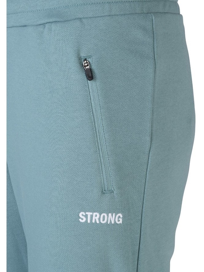 erima Spodnie dresowe "Strong Comfy" w kolorze turkusowym rozmiar: M
