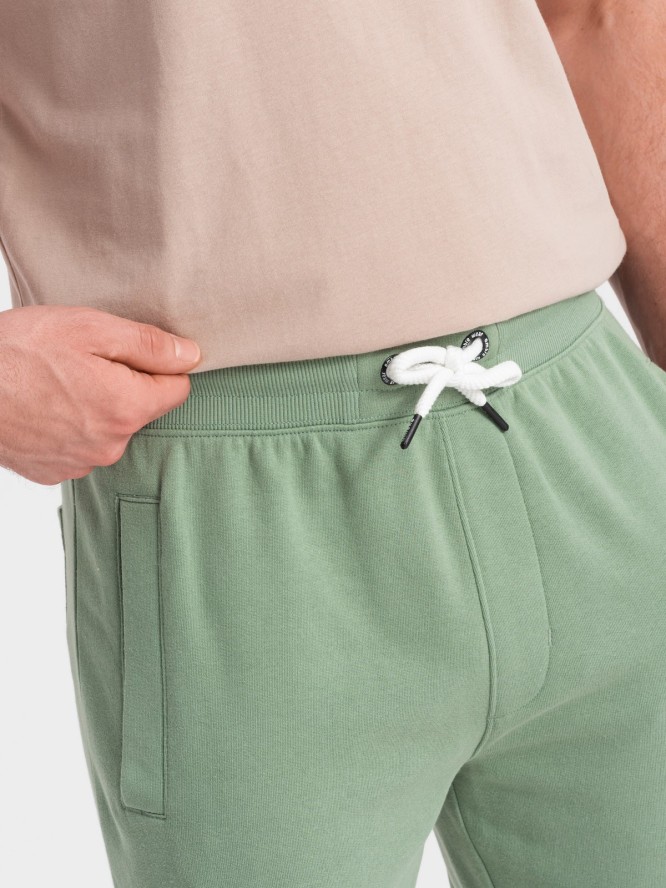 Spodnie męskie dresowe z nogawką bez ściągacza - zielone V3 OM-PABS-0206 - XXL