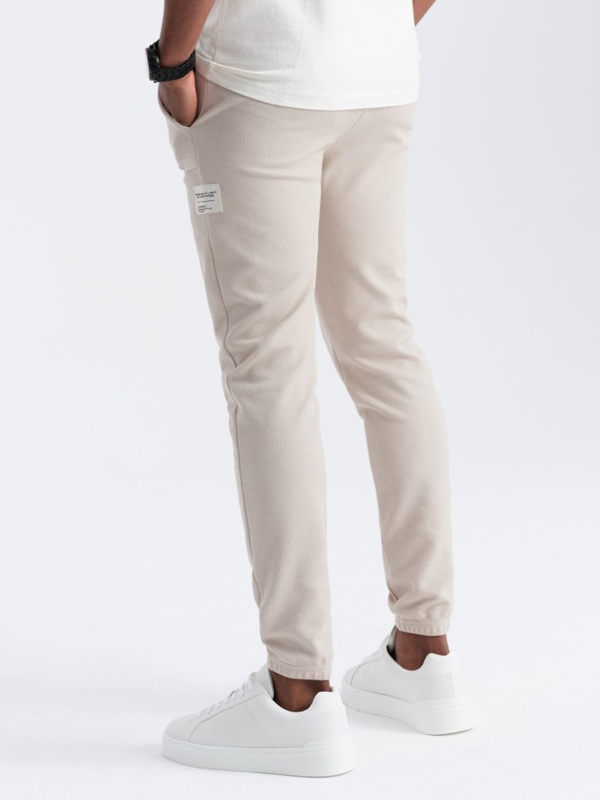 Męskie spodnie dresowe ze strukturalnej dzianiny - jasnobeżowe V1 OM-PASK-0211 - XXL