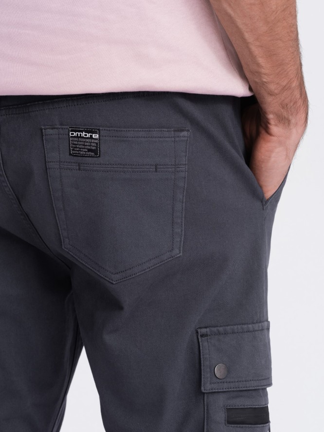 Męskie spodnie JOGGERY z zapinanymi kieszeniami cargo - grafitowe V3 OM-PAJO-0125 - XXL