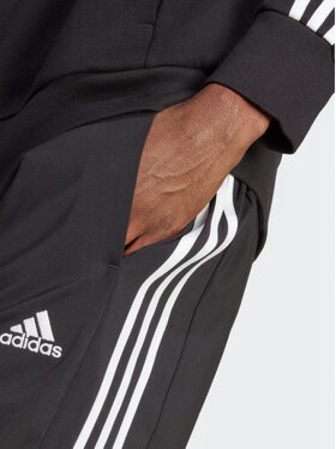 adidas Spodnie dresowe AEROREADY Essentials Tapered Cuff Woven 3-Stripes Joggers IC0041 Czarny Regular Fit
