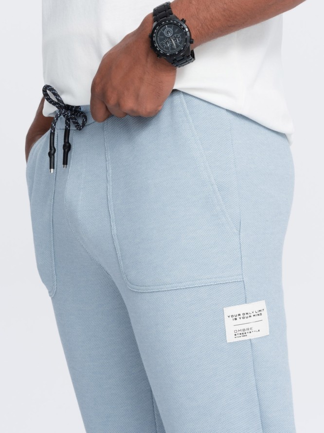 Spodnie męskie dresowe ze strukturalnej dzianiny - jasnoniebieskie V4 OM-PASK-0211 - XXL