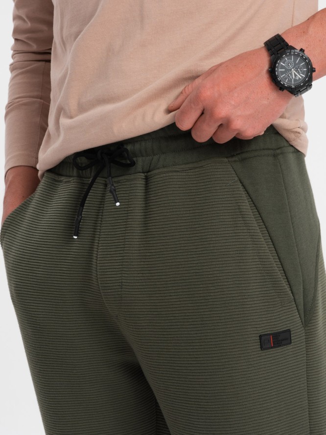 Męskie spodnie dresowe ze wstawkami z tkaniny ottoman - ciemnooliwkowe V3 OM-PASK-0127 - XXL