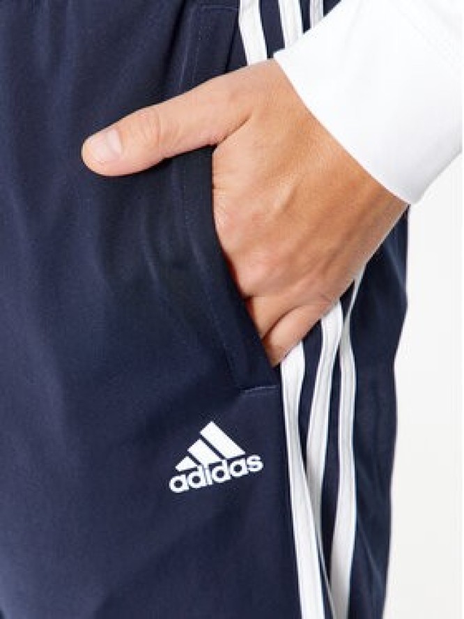 adidas Spodnie dresowe Essentials Warm-Up 3-Stripes H46106 Granatowy Regular Fit
