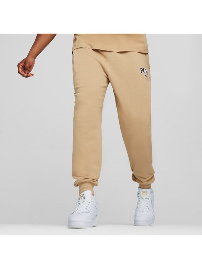 Puma Spodnie dresowe "Squad" w kolorze beżowym rozmiar: S