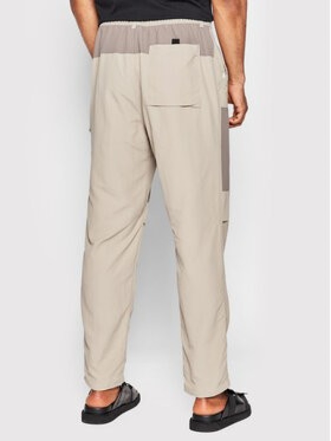 New Balance Spodnie materiałowe MP21502 Beżowy Relaxed Fit