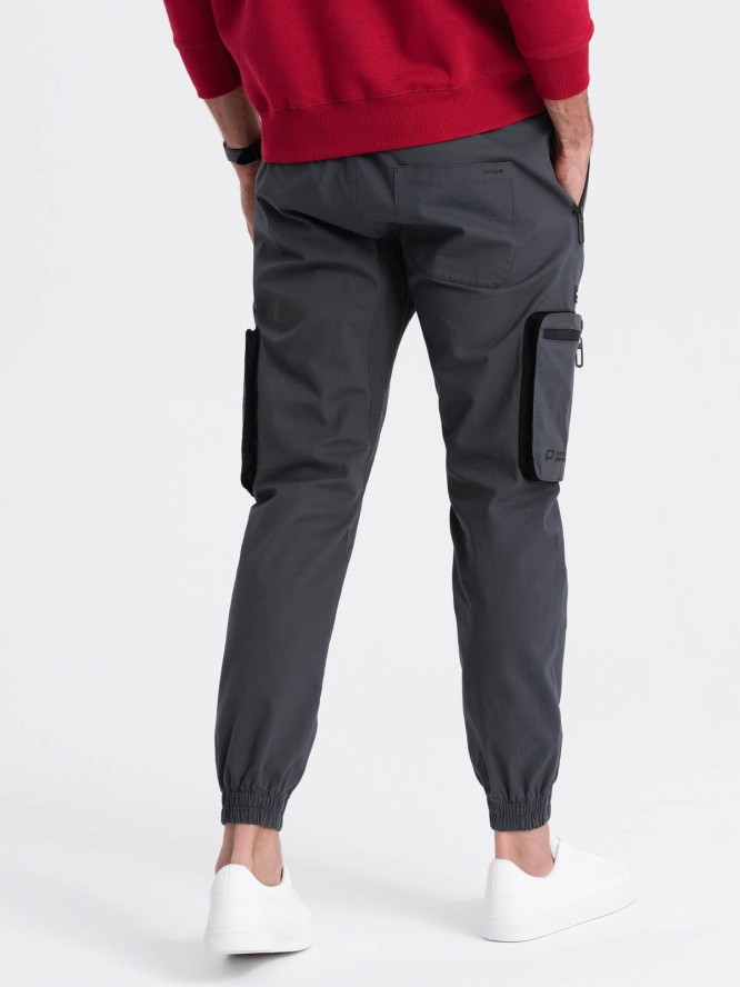 Męskie spodnie JOGGERY z odstającymi i zapinanymi kieszeniami cargo - grafitowe V6 OM-PAJO-0135 - XXL