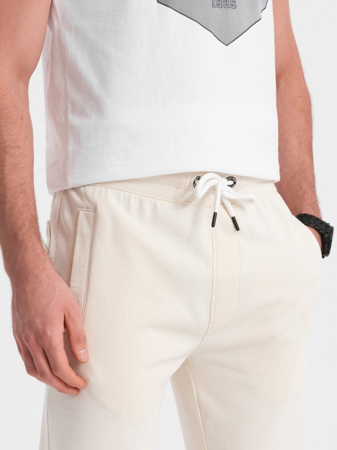 Męskie spodnie dresowe z nogawką bez ściągacza - kremowe V11 OM-PABS-0206 - XXL