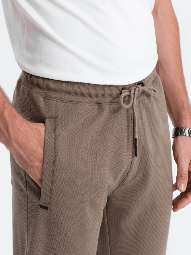 Męskie spodnie dresowe o marchewkowym kroju - brązowe V2 OM-PASK-0166 - XXL