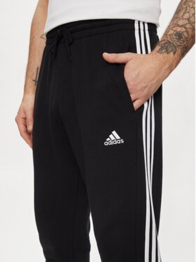 adidas Spodnie dresowe Essentials French Terry Tapered Cuff 3-Stripes Joggers HA4337 Czarny Regular Fit