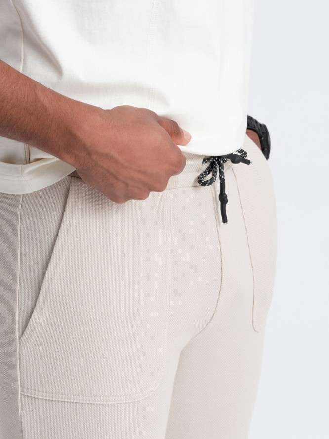 Męskie spodnie dresowe ze strukturalnej dzianiny - jasnobeżowe V1 OM-PASK-0211 - XXL