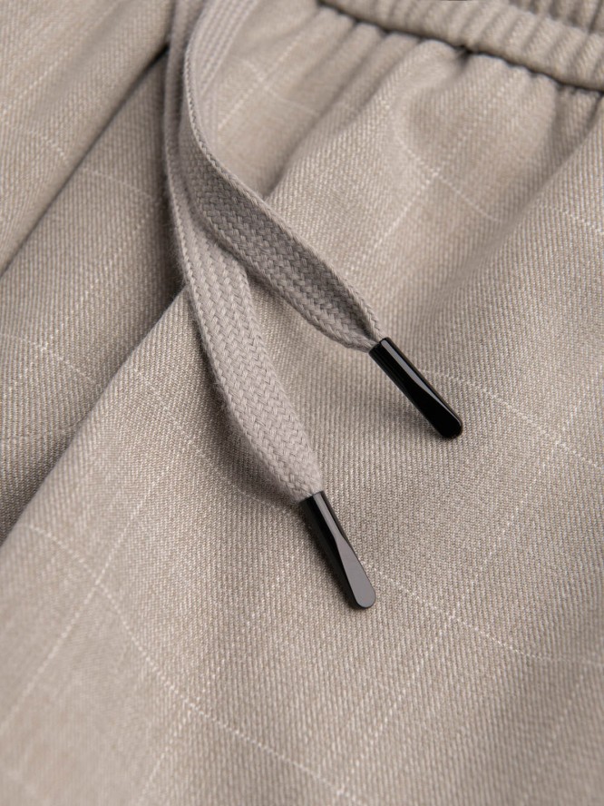 Spodnie męskie w kratkę z gumką w pasie - jasnoszare V1 OM-PACP-0122 - XL
