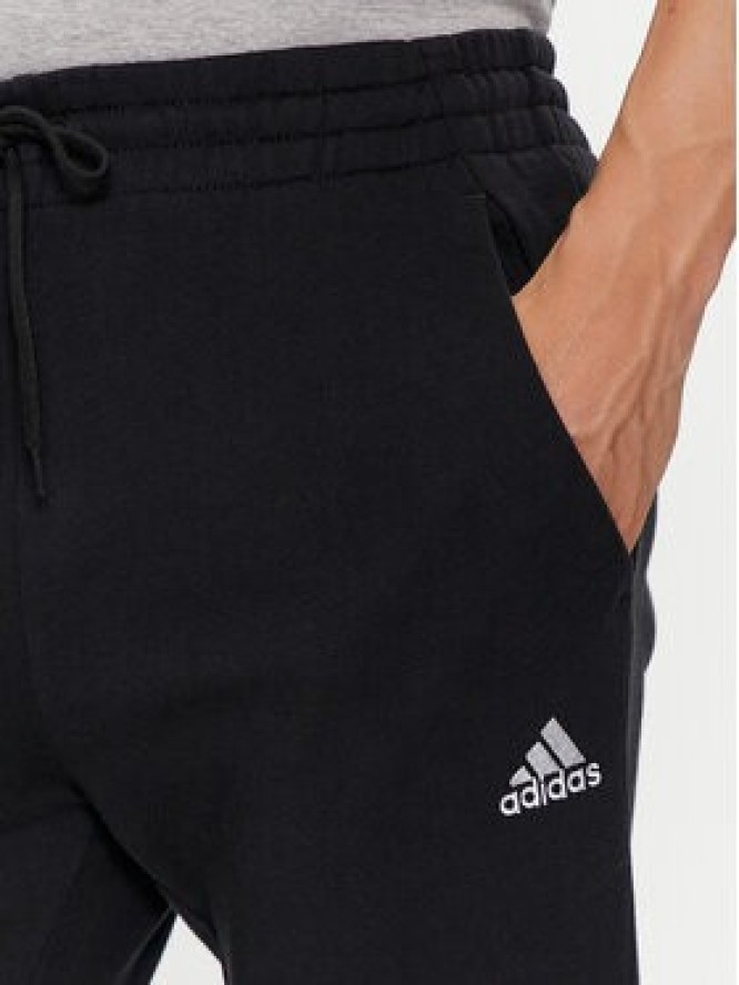 adidas Spodnie dresowe Essentials French Terry Tapered Cuff Logo Joggers IC0063 Czarny Regular Fit