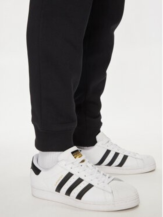 adidas Spodnie dresowe Trefoil Essentials IR7798 Czarny Slim Fit