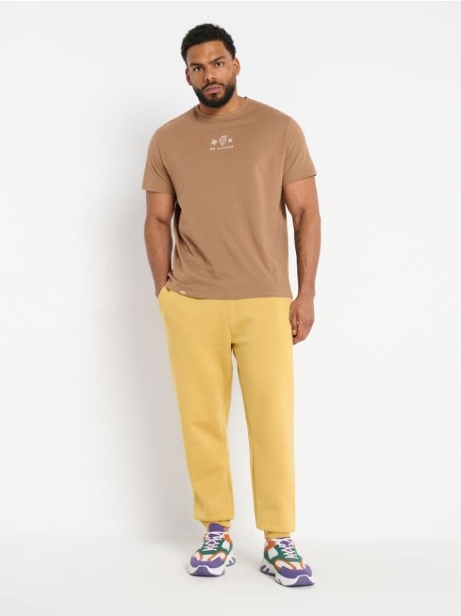 Spodnie dresowe jogger - żółty