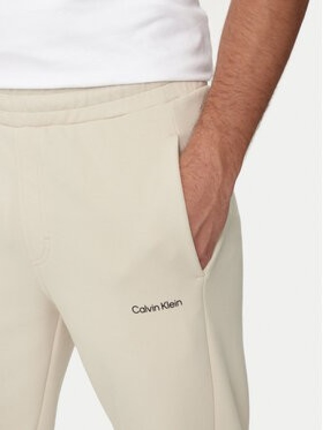 Calvin Klein Spodnie dresowe Micro Logo K10K109940 Beżowy Regular Fit